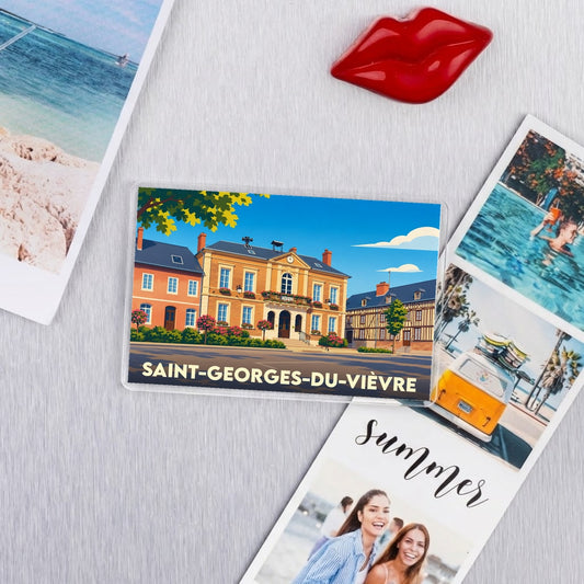 Magnet souvenir de la ville de Saint-Georges-du-Vièvre avec une illustration stylisée de sa mairie.