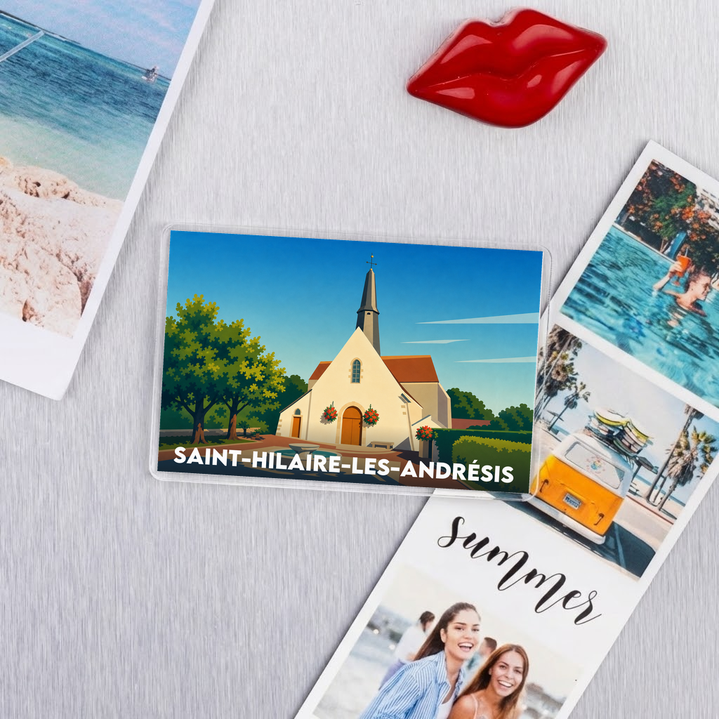 Magnet souvenir de la ville de Saint-Hilaire-les-Andrésis avec une illustration stylisée.