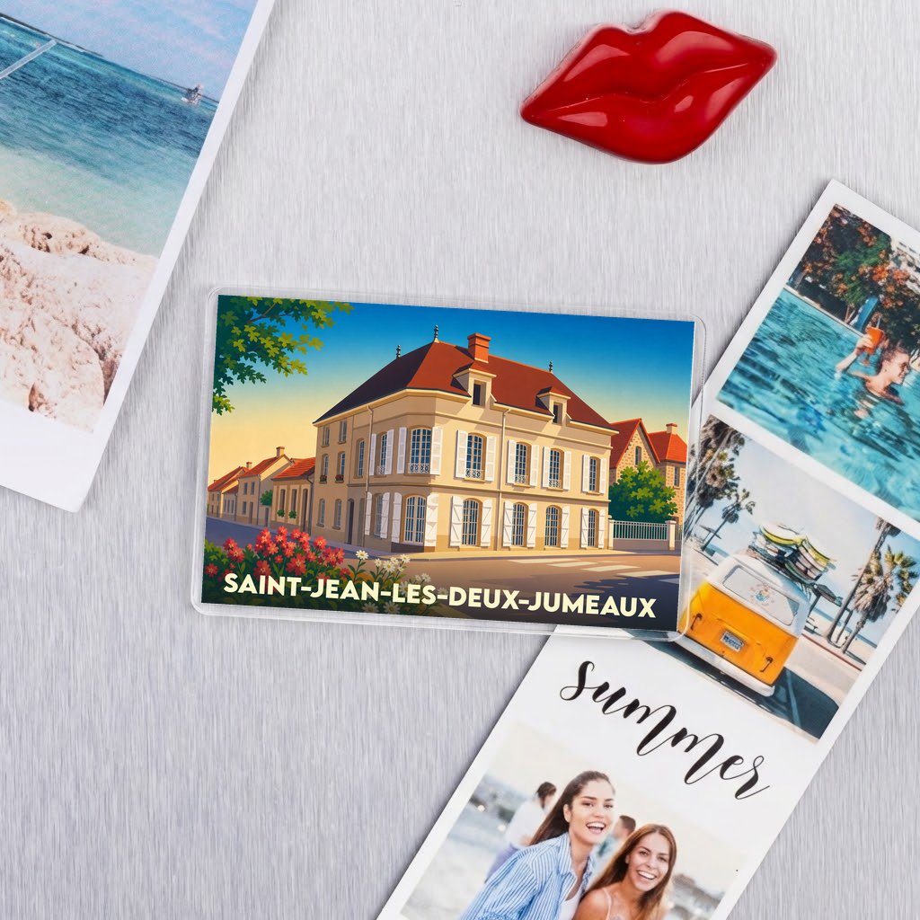 Magnet souvenir de la ville de Saint-Jean-les-Deux-Jumeaux avec une illustration stylisée d'un bâtiment ancien.