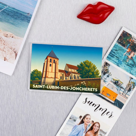 Magnet souvenir de la ville de Saint-Lubin-des-Joncherets avec une illustration stylisée de son église.