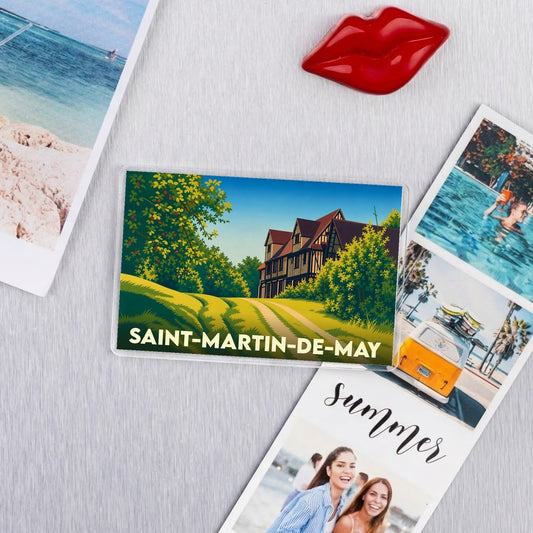 Magnet souvenir de la ville de Saint-Martin-de-May avec une illustration stylisée d'un manoir normand.
