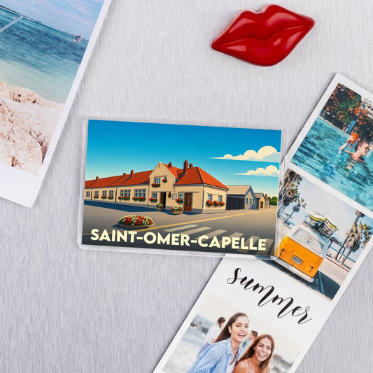 Magnet souvenir de la ville de Saint-Omer-Capelle avec une illustration stylisée.