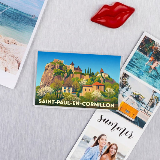 Magnet souvenir de la ville de Saint-Paul-en-Cornillon avec une illustration stylisée d'un château perché sur une colline.