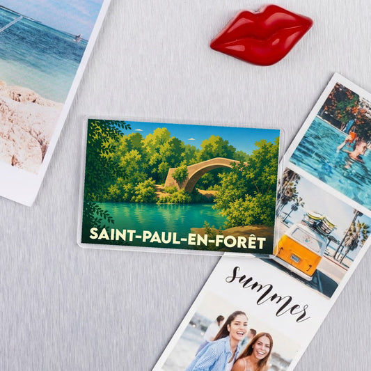 Magnet souvenir de la ville de Saint-Paul-en-Forêt avec une illustration stylisée d'un pont en pierre.