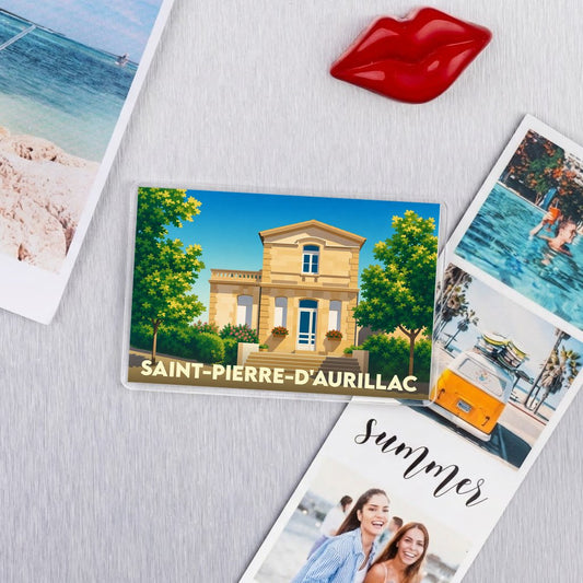 Magnet souvenir de la ville de Saint-Pierre-d'Aurillac avec une illustration stylisée d'un bâtiment historique.