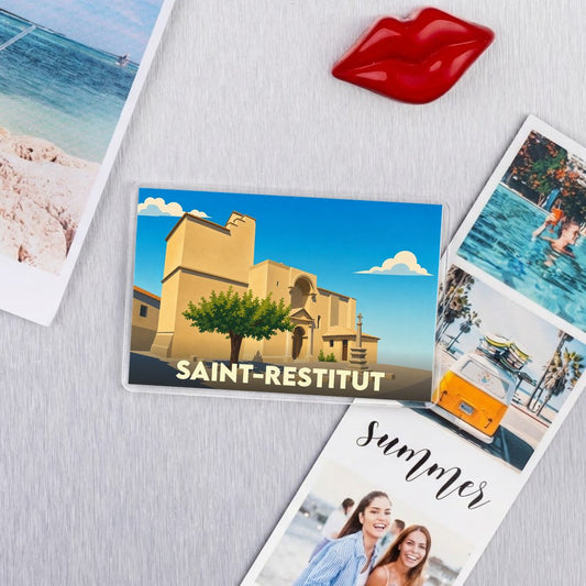 Magnet souvenir de la ville de Saint-Restitut avec une illustration stylisée de son église.