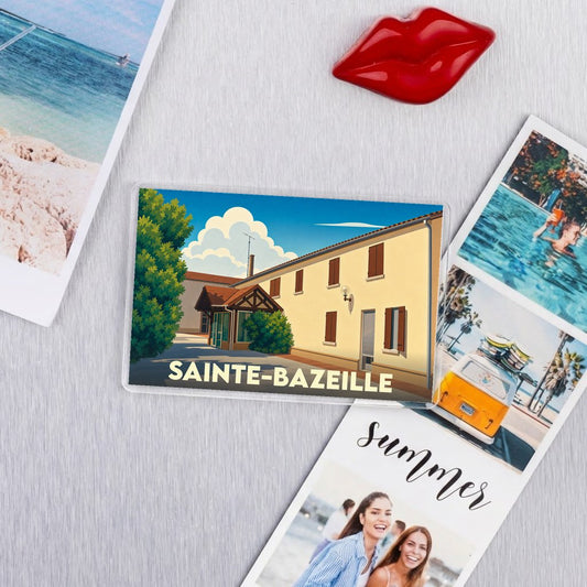Magnet souvenir de la ville de Sainte-Bazeille avec une illustration stylisée.