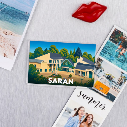 Magnet souvenir de la ville de Saran avec une illustration stylisée.