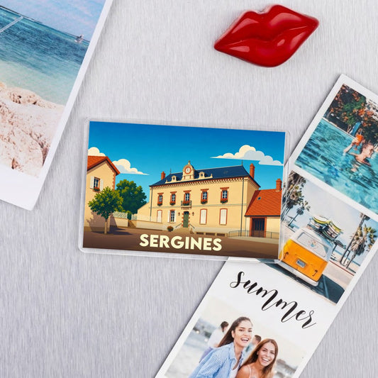 Magnet souvenir de la ville de Sergines avec une illustration stylisée d'un bâtiment historique.