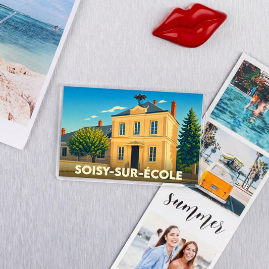 Magnet souvenir de la ville de Soisy-sur-École avec une illustration stylisée d'un bâtiment emblématique.
