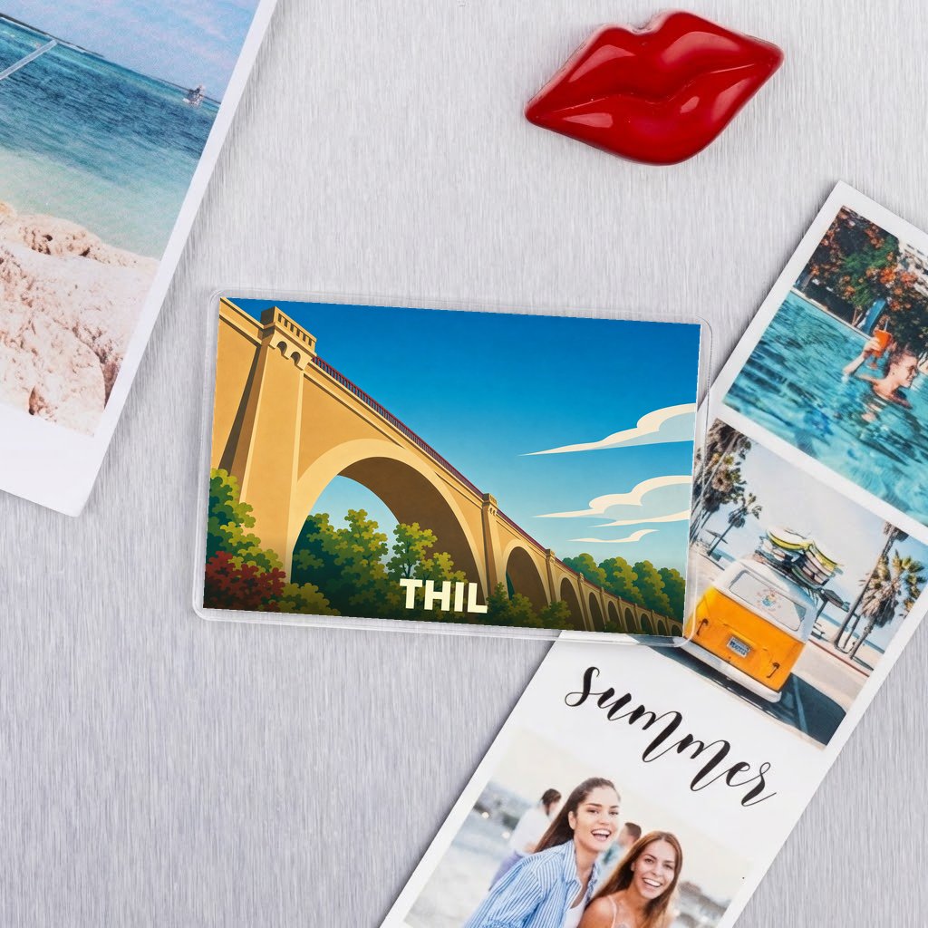 Magnet souvenir de la ville de Thil avec une illustration stylisée de son viaduc.