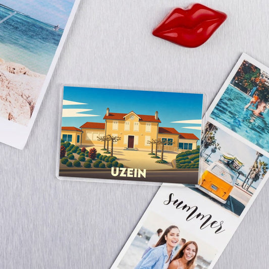 Magnet souvenir de la ville d'Uzein avec une illustration stylisée de sa mairie.