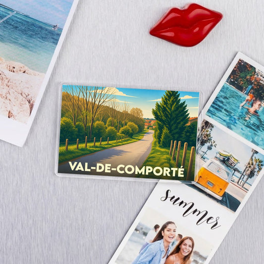 Magnet souvenir de la ville de Val-de-Comporté avec une illustration stylisée d'un paysage de campagne.