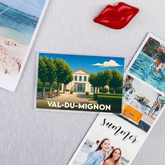 Magnet souvenir de la ville de Val-du-Mignon avec une illustration stylisée d'un parc et de son bâtiment.