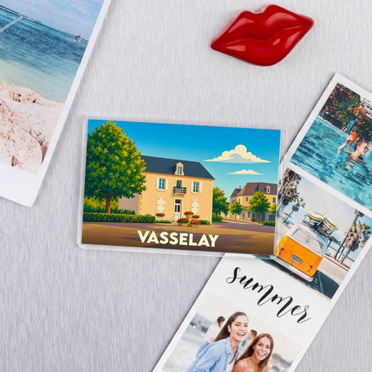 Magnet souvenir de la ville de Vasselay avec une illustration stylisée.