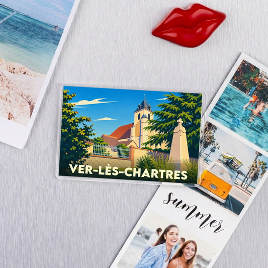 Magnet souvenir de Ver-lès-Chartres avec une illustration stylisée de son église et de son monument aux morts.