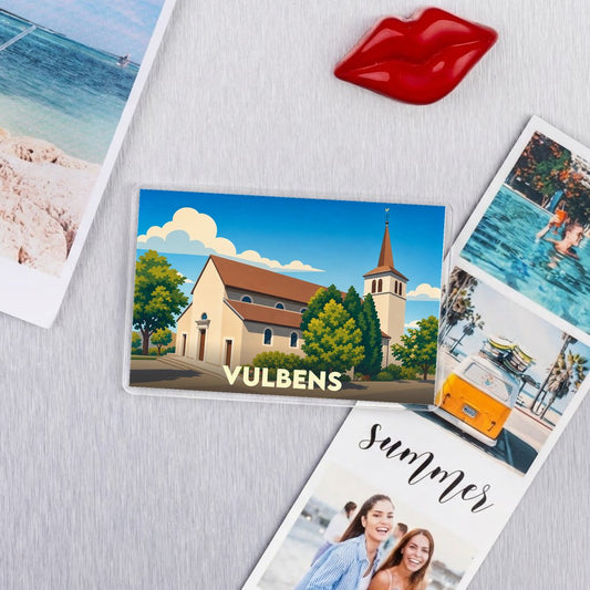 Magnet souvenir de la ville de Vulbens avec une illustration stylisée d'une église.