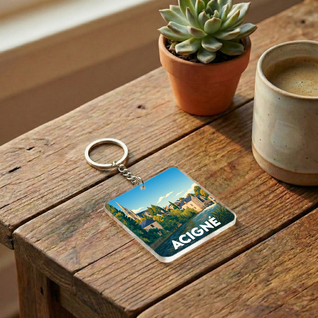 Porte-clés souvenir de la ville d'Acigné avec une illustration stylisée et colorée.