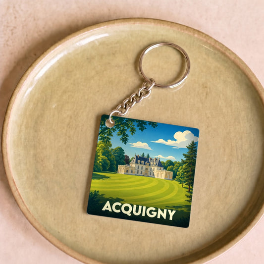 Porte-clés souvenir de la ville d'Acquigny avec une illustration stylisée de son château.