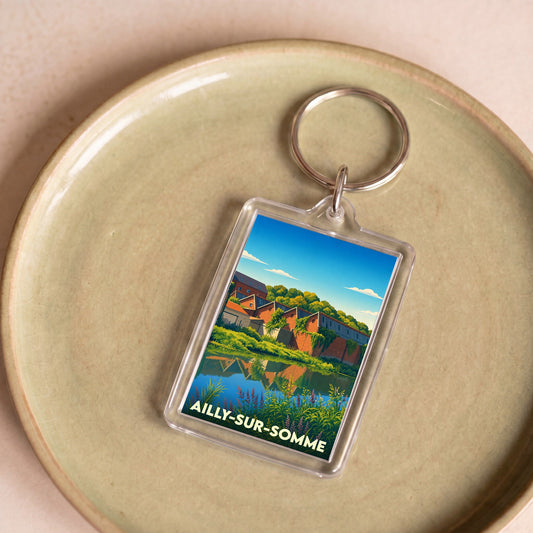 Porte-clés souvenir de la ville d'Ailly-sur-Somme avec une illustration stylisée.