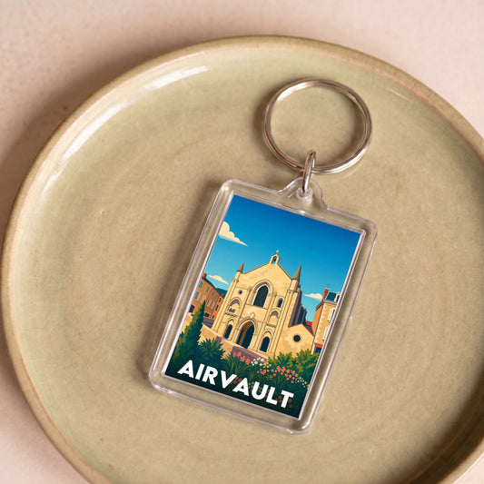 Porte-clés souvenir de la ville d'Airvault avec une illustration stylisée de son patrimoine.