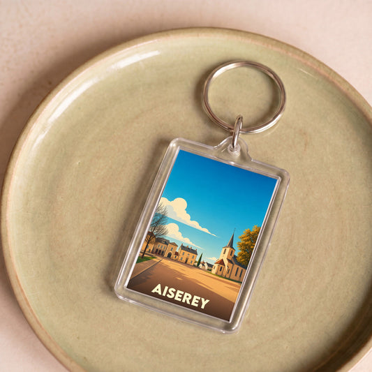 Porte-clés souvenir de la ville d'Aiserey avec une illustration stylisée.