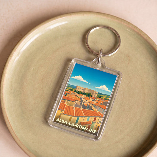 Porte-clés souvenir de la ville de Alba-la-Romaine avec une illustration stylisée.