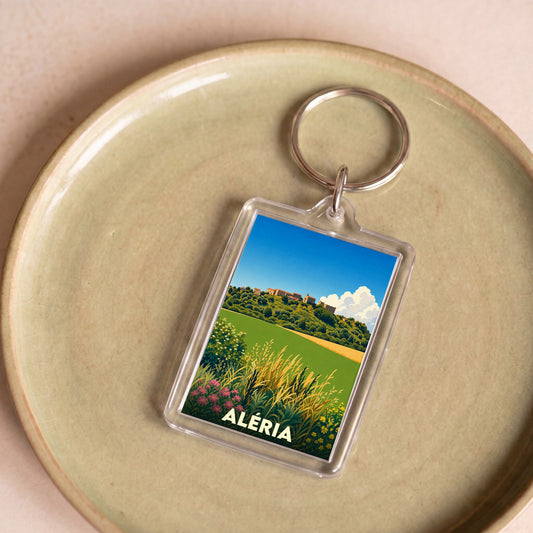 Porte-clés souvenir de la ville d'Aléria avec une illustration stylisée de son paysage.