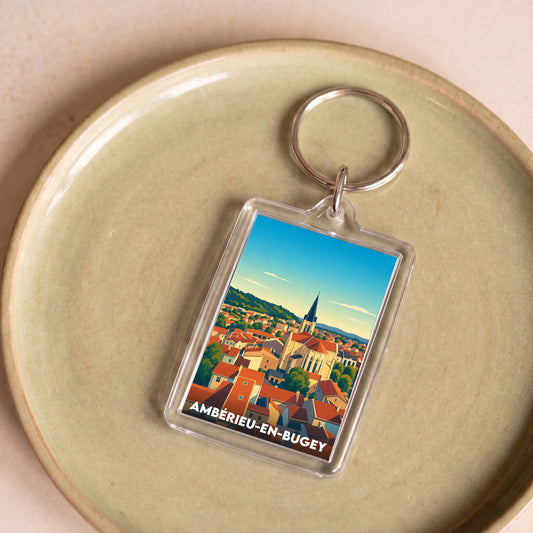 Porte-clés souvenir de la ville d'Ambérieu-en-Bugey avec une illustration stylisée.