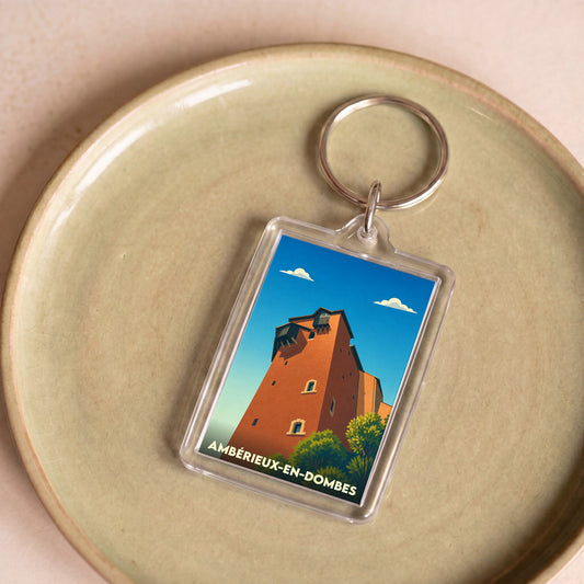 Porte-clés souvenir de la ville de Ambérieux-en-Dombes avec une illustration stylisée de son château.