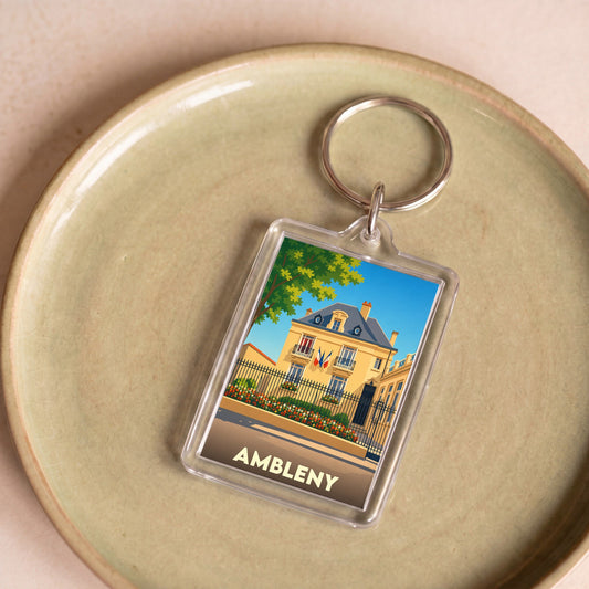 Porte-clés souvenir de la ville d'Ambleny avec une illustration stylisée.