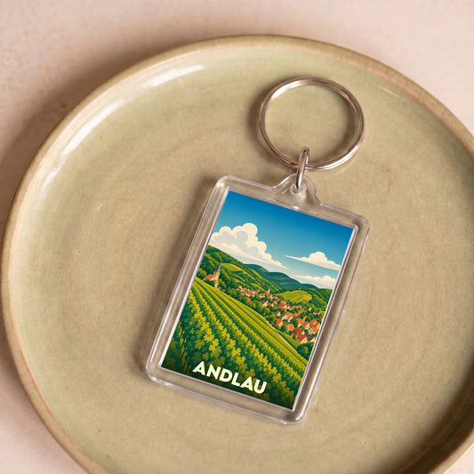 Porte-clés souvenir de la ville d'Andlau avec une illustration stylisée de son vignoble.