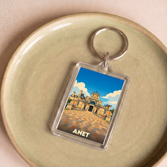 Porte-clés souvenir de la ville d'Anet avec une illustration stylisée de son château.
