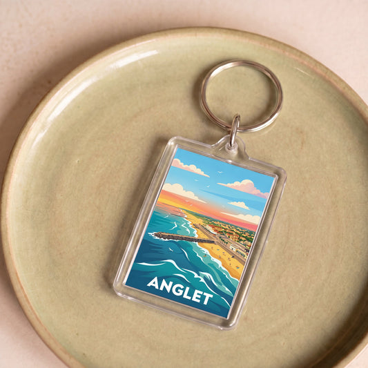 Porte-clés souvenir de la ville d'Anglet avec une illustration stylisée de son littoral.