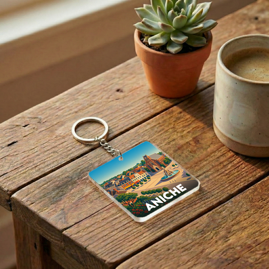 Porte-clés souvenir de la ville d'Aniche avec une illustration stylisée.
