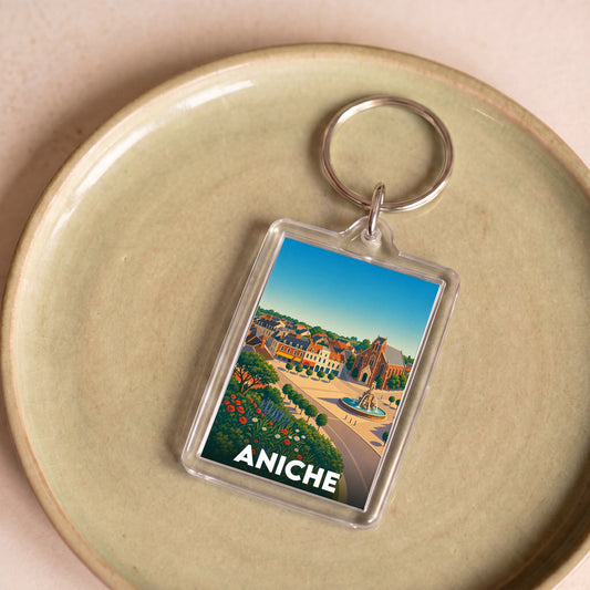 Porte-clés souvenir de la ville d'Aniche avec une illustration stylisée.
