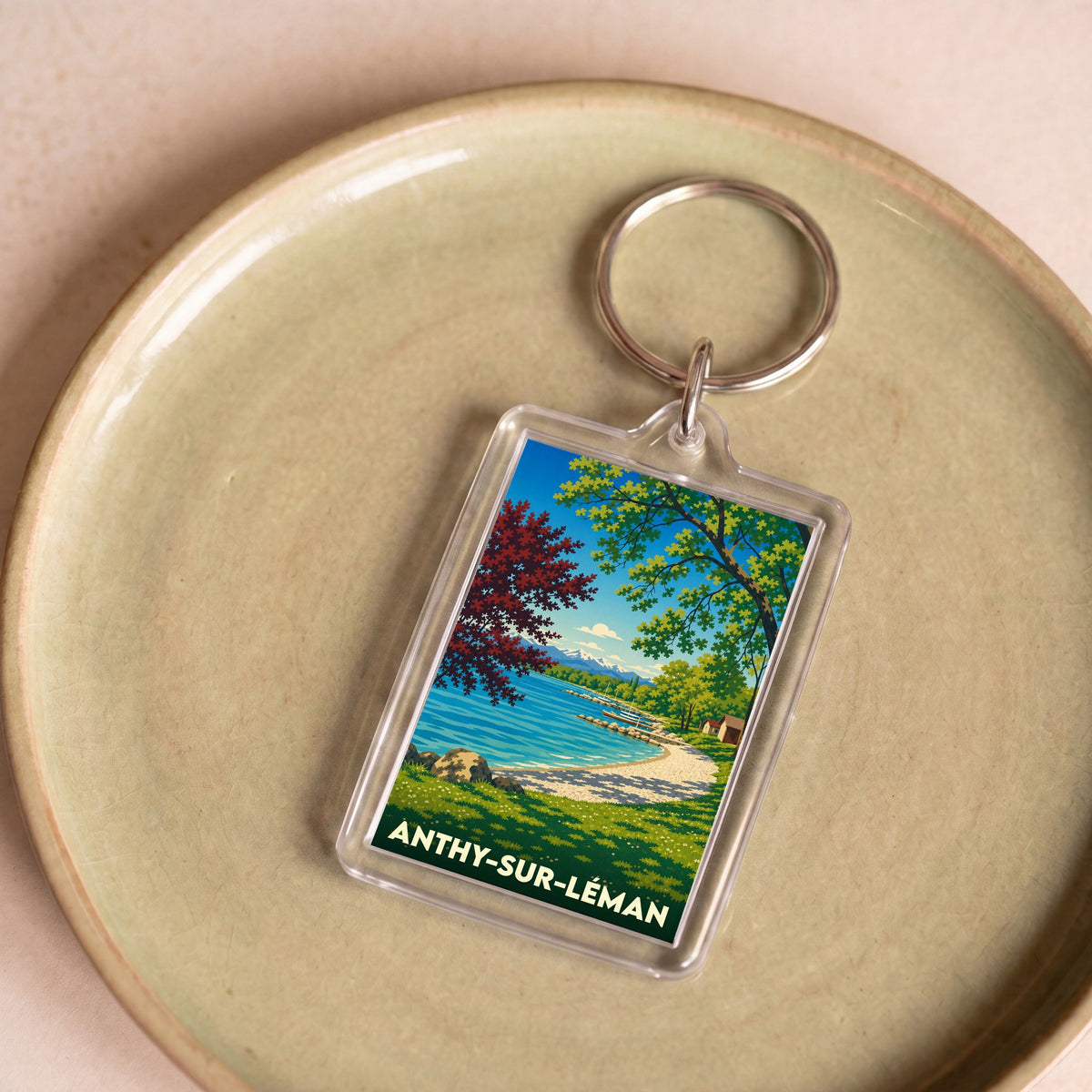 Porte-clés souvenir de la ville d’Anthy-sur-Léman avec une illustration stylisée des bords du lac.