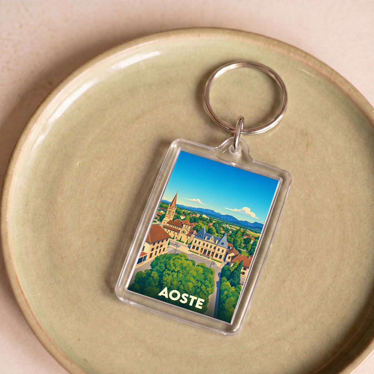 Porte-clés souvenir de la ville d'Aoste avec une illustration stylisée.