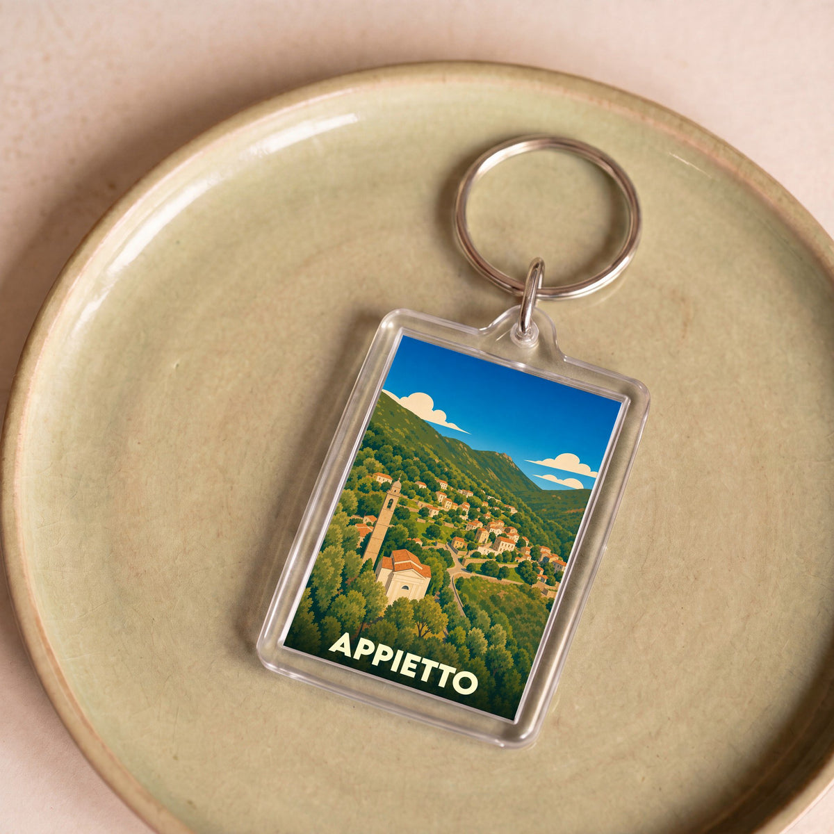 Porte-clés souvenir de la ville d'Appietto avec une illustration stylisée.