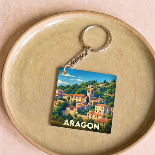 Porte-clés souvenir de la ville de Aragon avec une illustration stylisée.