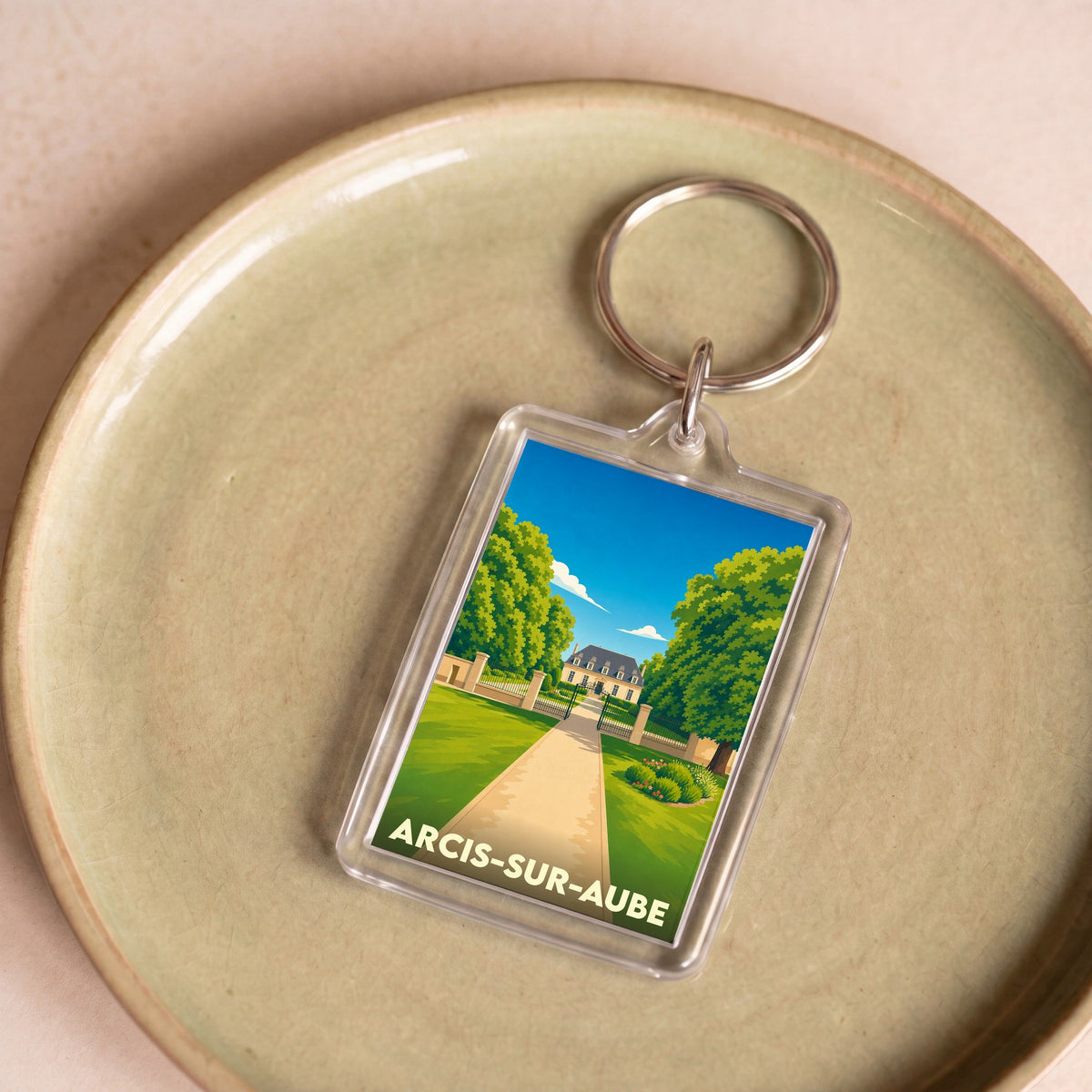 Porte-clés souvenir de la ville d'Arcis-sur-Aube avec une illustration stylisée.