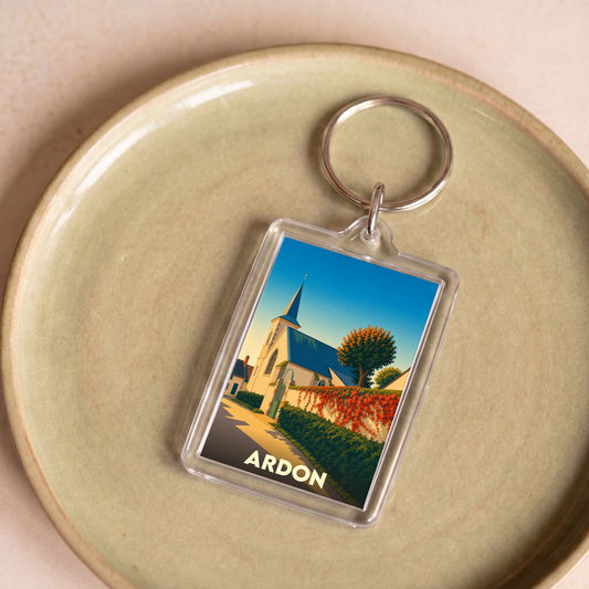 Porte-clés souvenir de la ville d'Ardon avec une illustration stylisée de son église.