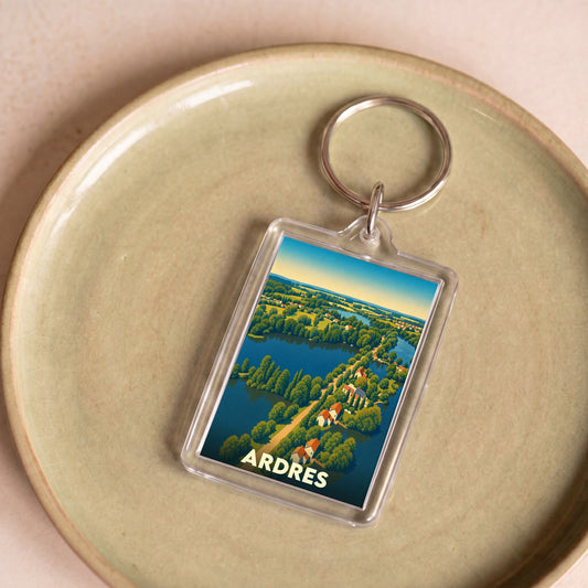 Porte-clés souvenir de la ville de Ardres avec une illustration stylisée de ses paysages et plans d'eau.