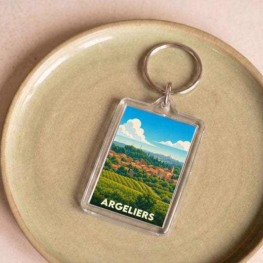 Porte-clés souvenir de la ville d'Argeliers avec une illustration stylisée de son paysage vallonné.