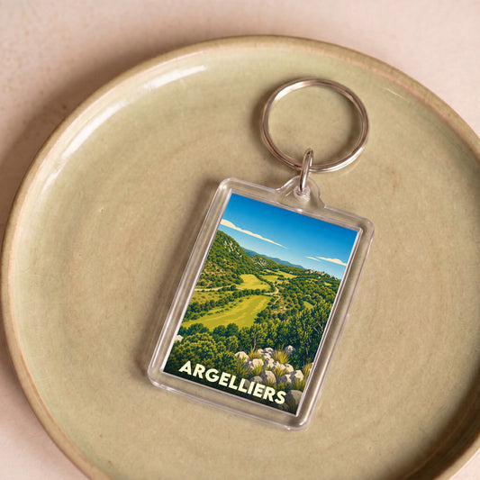 Porte-clés souvenir de la ville d'Argelliers avec une illustration stylisée de son paysage vallonné.