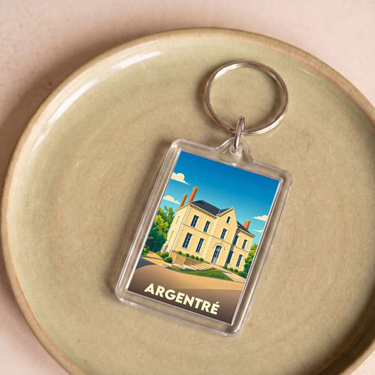 Porte-clés souvenir de la ville d'Argentré avec une illustration stylisée d'un manoir.