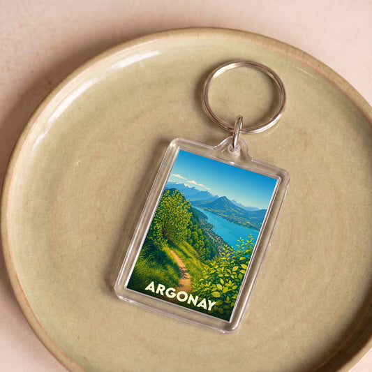 Porte-clés souvenir de la ville d'Argonay avec une illustration stylisée de son paysage montagneux.