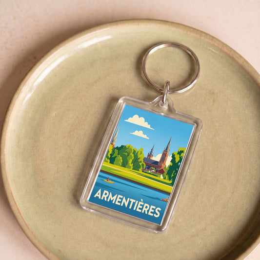 Porte-clés souvenir de la ville d'Armentières avec une illustration stylisée.