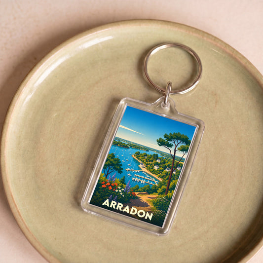 Porte-clés souvenir de la ville de Arradon avec une illustration stylisée de son littoral.