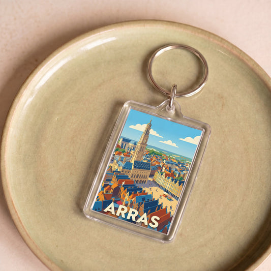 Porte-clés souvenir de la ville d'Arras avec une illustration stylisée et colorée.